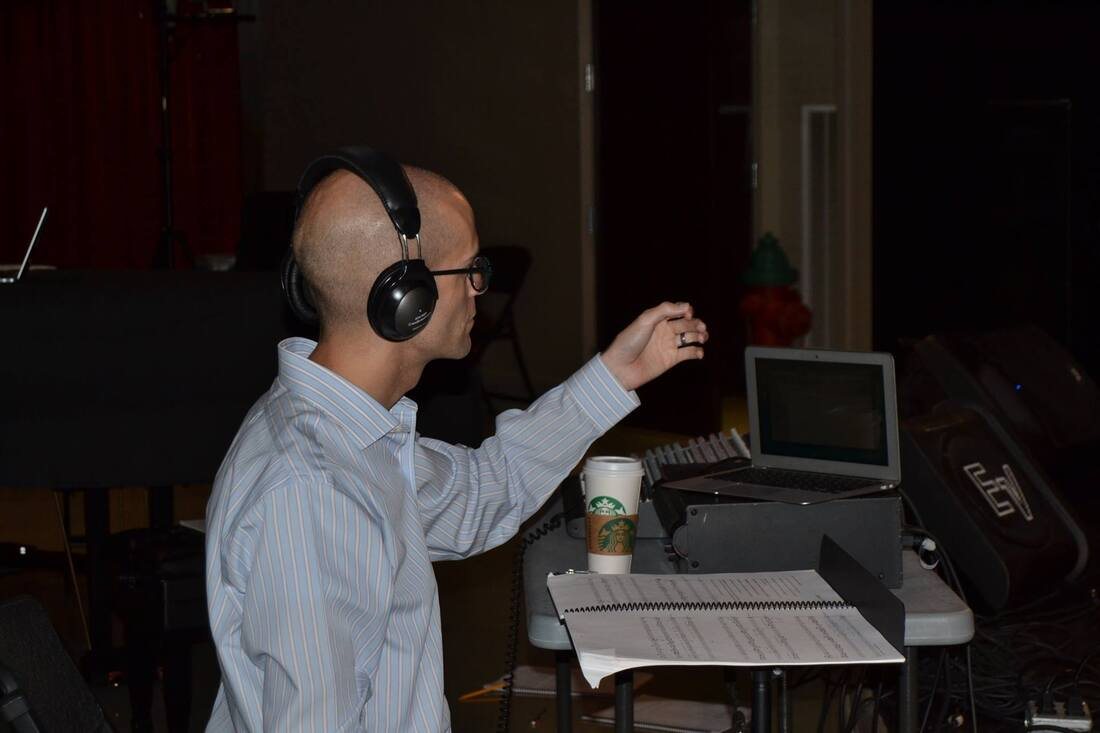 Amir Zaheri conducting a rehearsal of an electronic opera