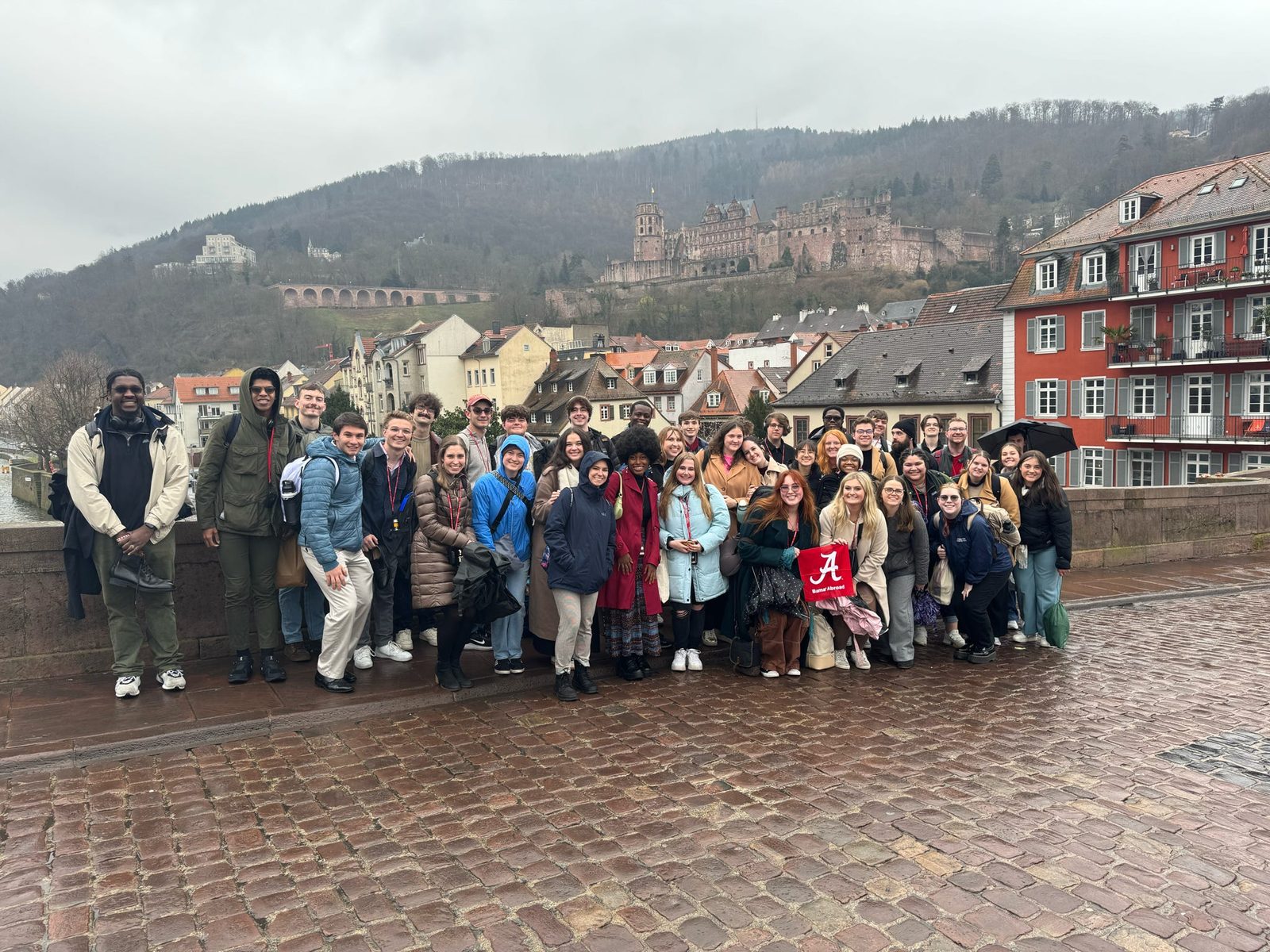 The University of Alabama University Singers in Heidelberg, with the castle above the old town