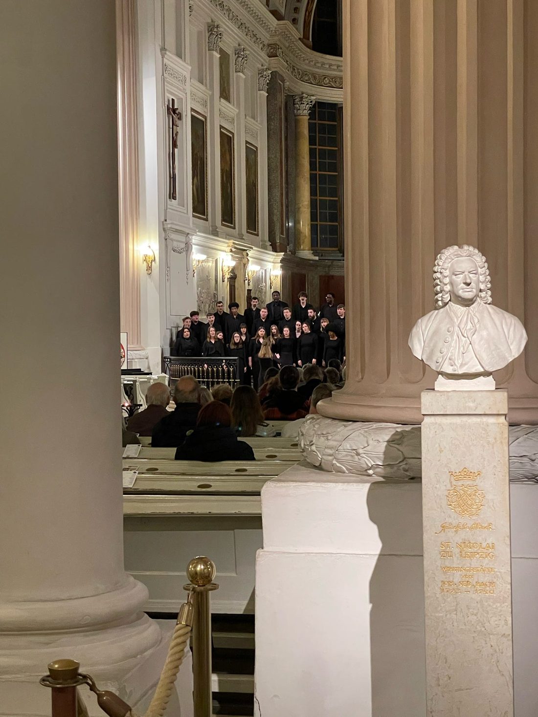 The University Singers performing in the Nikolaikirche in Leipzig, beside a bust of Johann Sebastian Bach