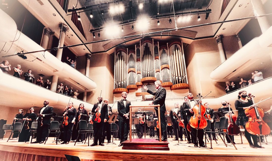 Amir Zaheri taking a bow as organ soloist with orchestra